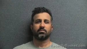 Mugshot of FARHAN MUHAMMAD KHOKHAR booked in Boone County, Kentucky on April 21, 2026