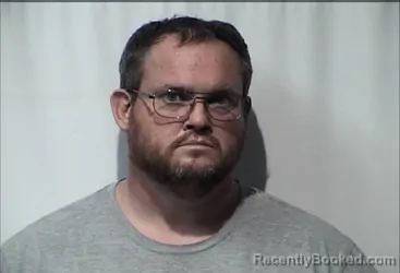 Mugshot of DUSTIN ELVA HARTMAN