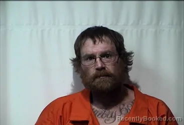 Mugshot of JUSTIN CARL EVANS booked in Christian County, Kentucky on April 4, 2026