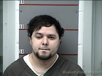 Mugshot of RUBEN REYES-FLORES