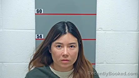 Mugshot of XIANGMEI WEN booked in Grayson County, Kentucky on May 14, 2026