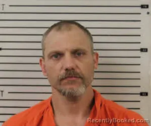 Mugshot of JOHN AARON CHANDLER booked in Madison County, North Carolina on July 12, 2026