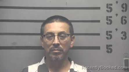 Mugshot of JUAN CORONADO ALDANA