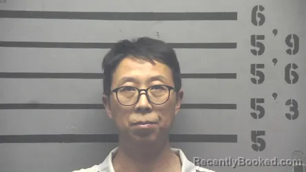 Mugshot of JUNWEI GUAN booked in Hopkins County, Kentucky on April 27, 2026