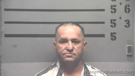 Mugshot of Carlos Martinez-Delgado booked in Hopkins County, Kentucky on August 18, 2026