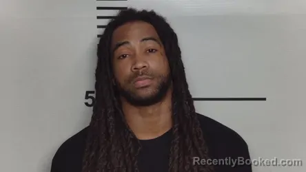 Mugshot of CHARMONT . THOMPSON