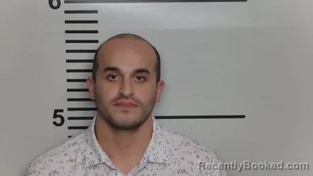 Mugshot of LOGAN DESAI booked in Jefferson County, Kentucky on March 18, 2026