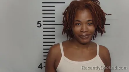 Mugshot of LOVE NICOLE WOODS booked in Jefferson County, Kentucky on March 21, 2026