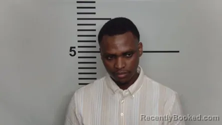 Mugshot of OLIVIER B MUSONI booked in Jefferson County, Kentucky on March 22, 2026