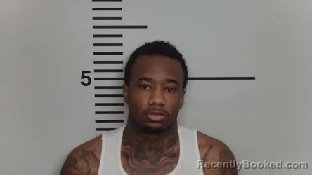 Mugshot of GEORGES MUHINDO booked in Jefferson County, Kentucky on March 24, 2026