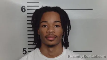 Mugshot of AKELACHI E URIRI booked in Jefferson County, Kentucky on March 26, 2026