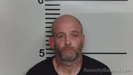 Mugshot of Travis Tosten