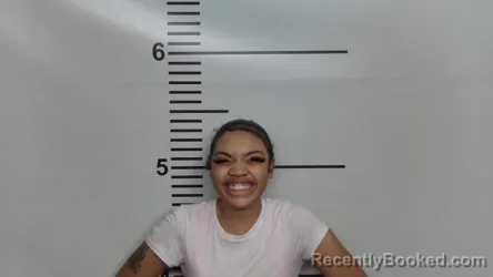 Mugshot of MIKIA MARIE CRAWFORD booked in Jefferson County, Kentucky on May 30, 2026