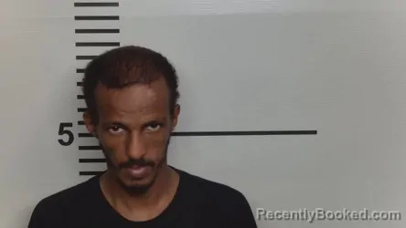 Mugshot of Mohamed Adan booked in Jefferson County, Kentucky on October 20, 2026