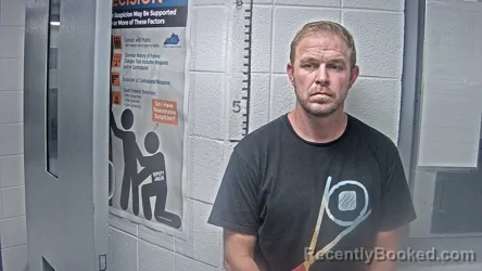 Mugshot of Justin Cooper booked in Letcher County, Kentucky on August 28, 2026