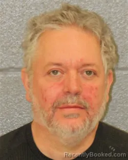 Mugshot of JOHN CHADWICK HUTCHESON