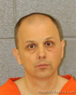 Mugshot of DRAZAN SINANOVIC booked in Mecklenburg County, North Carolina on March 24, 2026