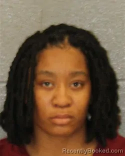 Mugshot of LAKEISHA SHANAVIUS WOODARD booked in Mecklenburg County, North Carolina on March 25, 2026