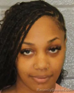 Mugshot of NIEJA MONIQUE COLE booked in Mecklenburg County, North Carolina on March 25, 2026