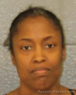 Mugshot of SNOW KEMA SIMMONS booked in Mecklenburg County, North Carolina on April 2, 2026