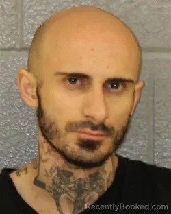 Mugshot of ALEKSANDROS SOUTZOS booked in Mecklenburg County, North Carolina on April 4, 2026