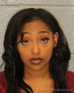 Mugshot of JASMINE ABSULAZIZ OSMAN booked in Mecklenburg County, North Carolina on May 14, 2026