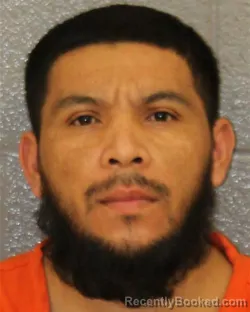 Mugshot of WILMER OVANDO VASQUEZ-AYESTAS booked in Mecklenburg County, North Carolina on February 15, 2026