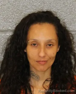 Mugshot of ALEXIS KYANN MERCADO booked in Mecklenburg County, North Carolina on June 10, 2026
