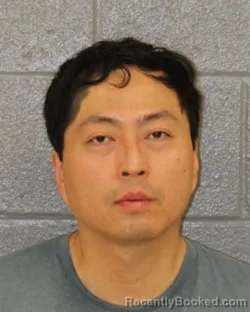 Mugshot of QU MING WANG booked in Mecklenburg County, North Carolina on July 10, 2026