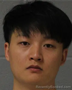 Mugshot of Hui Wang booked in Mecklenburg County, North Carolina on August 11, 2026