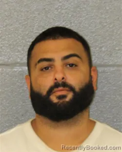 Mugshot of Amir Ali Motamedi booked in Mecklenburg County, North Carolina on August 23, 2026