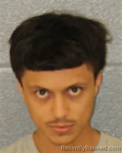 Mugshot of Christopher Oziel Hernandez-Conejo booked in Mecklenburg County, North Carolina on October 9, 2026