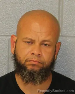 Mugshot of Carlos Edward Santos booked in Mecklenburg County, North Carolina on October 19, 2026