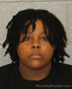 Mugshot of Genesis Moses booked in Mecklenburg County, North Carolina on October 22, 2026