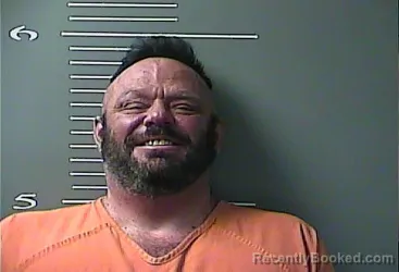 Mugshot of Elmer None Harris booked in Martin County, Kentucky on October 6, 2026