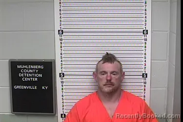 Mugshot of JOHN DELMER EVANS booked in Muhlenberg County, Kentucky on June 24, 2026