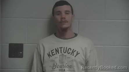 Mugshot of TYLER MARTIN HUGHES