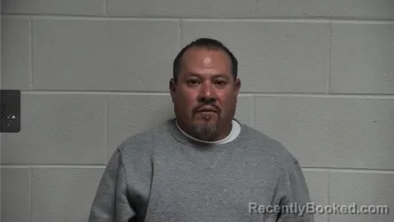 Mugshot of MIGUEL SIMENTAL FLORES booked in Oldham County, Kentucky on May 13, 2026