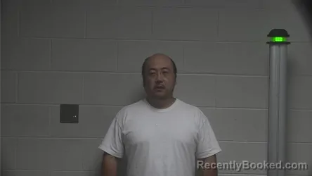 Mugshot of Fengxiang Lyu booked in Oldham County, Kentucky on August 20, 2026