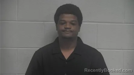 Mugshot of Claudy Louissaint booked in Oldham County, Kentucky on August 24, 2026