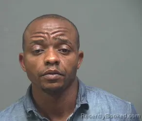 Mugshot of MICHAEL MWINI MULWA booked in Perry County, Kentucky on June 13, 2026