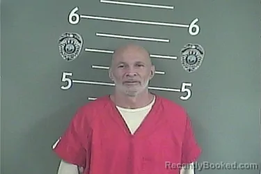 Mugshot of Angelo None Thompson booked in Pike County, Kentucky on July 27, 2026