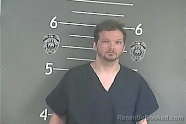 Mugshot of JUSTIN T DAMRON