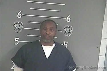 Mugshot of MACQUILLE . WOODARD