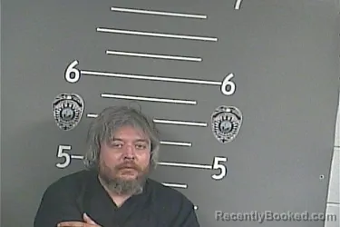 Mugshot of THOMAS W HUFFMAN