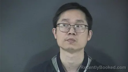 Mugshot of HUHAO HU booked in Russell County, Kentucky on April 20, 2026