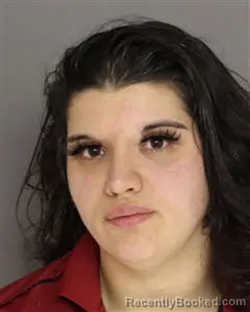 Mugshot of JASMINE MICHELE TORRES booked in Moore County, North Carolina on March 7, 2026