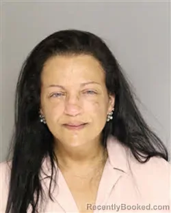 Mugshot of CONNIE FAYE TOMAT booked in Moore County, North Carolina on March 7, 2026