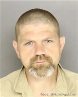 Mugshot of CHRISTOPHER WAYNE FLOWERS booked in Moore County, North Carolina on May 20, 2026