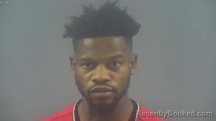 Mugshot of EKIMA KIZA booked in Warren County, Kentucky on April 1, 2026